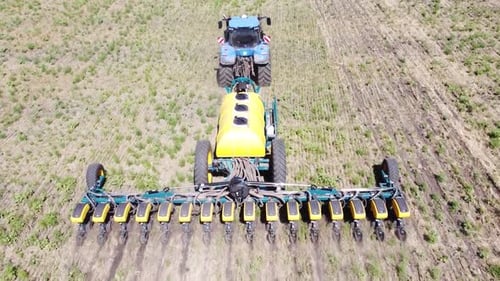 Blue Tractor O.A. Planting Canola On No Till Field