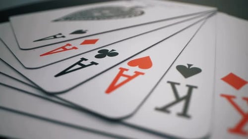 Playing Cards Spread on Dark Table - Close-Up Shot