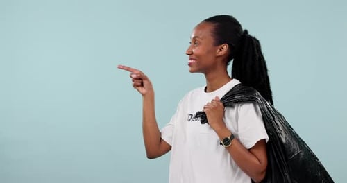 Trash bag, black woman point or volunteering okay gesture for pollution news
