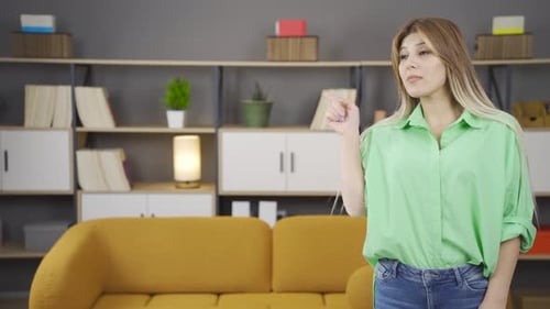Woman Gesturing Positively and Negatively in a Living Room
