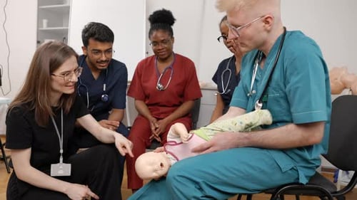 Medical Students Training with Infant Mannequin