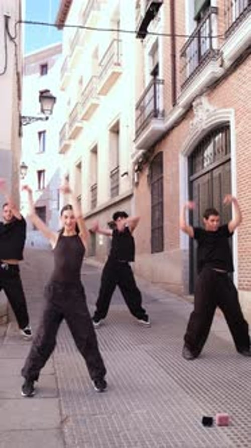 Contemporary dance crew performing in an european street