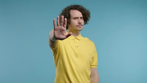 Serious Man Showing Rejecting Gesture By Stop Palm Sign Not Allow Prohibition