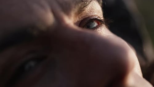 Dramatic close-up of an eye reflecting deep emotions and personal introspection