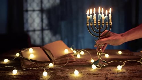 Hanukkah Menorah with Candles on Wooden Table
