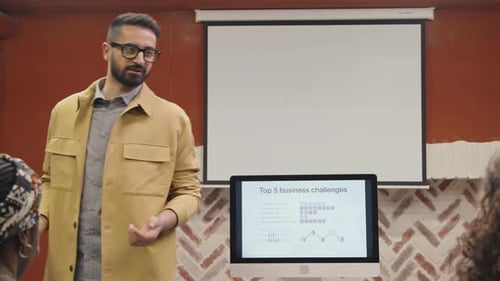 Man Presenting Business Challenges in Modern Workplace