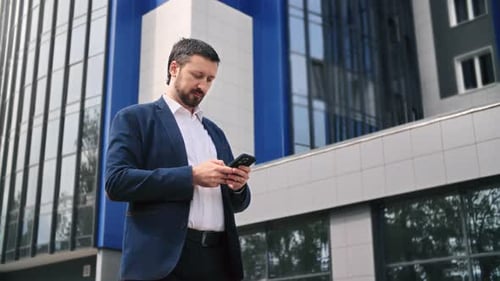 Successful Pensive Businessman Male Boss Online Chatting Use Smartphone Outdoor Downtown City Office