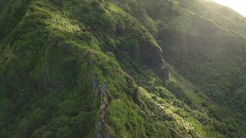 Close Up Drone Flight Over Mountain Range Green Cliffs Rocks Ridges Jungle Forest Blanket Mountains
