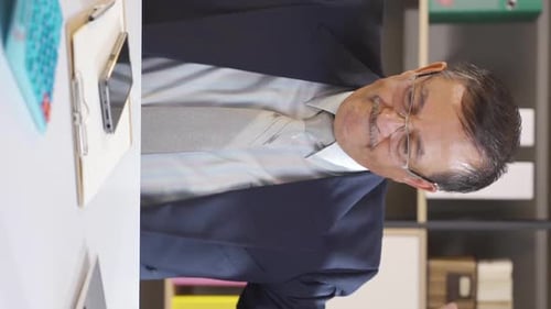 Vertical video of Failing and sad businessman.