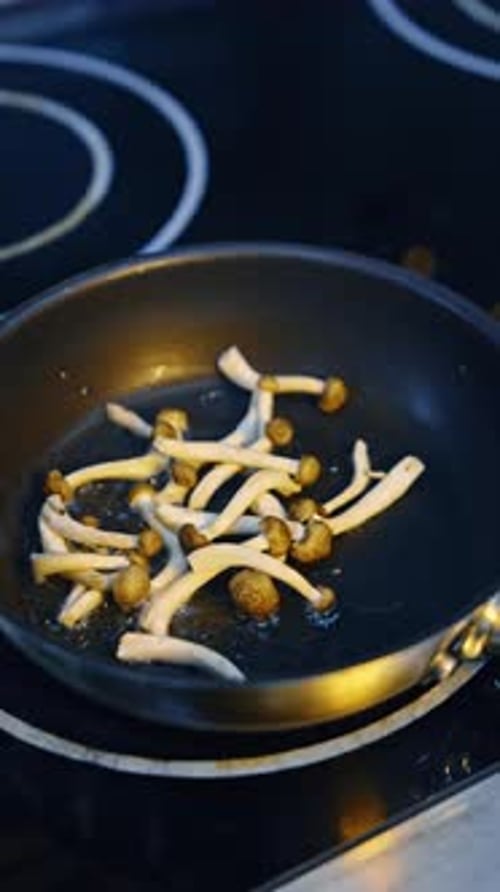 Mushrooms Frying in Pan on Stovetop