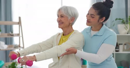 Physiotherapy, senior woman with dumbbell exercise and nurse in clinic for rehabilitation