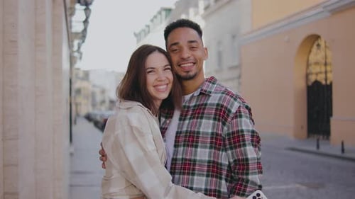 Portrait of Multiethnic Couple in Love on Narrow Streets of a European City The Guy and the Girl are