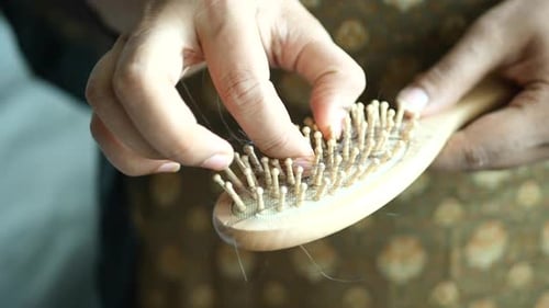 Women Hold Her Lost Hair Close Up