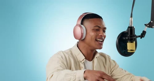 Singer, creative musician and man recording music or audio isolated in a studio blue background to