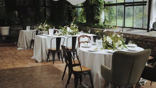 Elegant Wedding Reception Area with White Tables