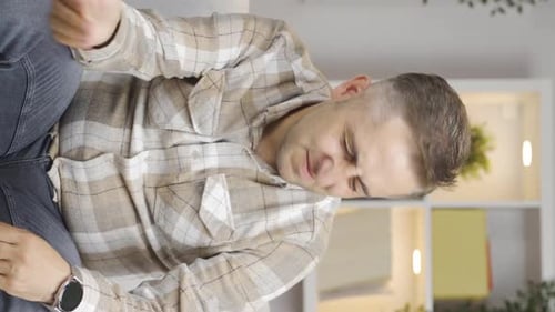 Vertical video of The man who is angry with himself and has faults.