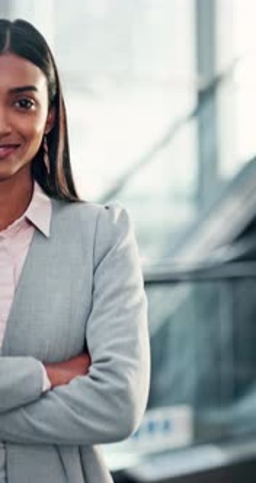 Business, woman and face with arms crossed in office for professional. corporate career or ambition