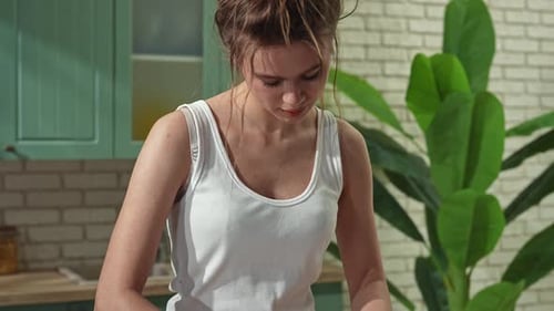 Young Woman at the Table in the Kitchen Preparing Spring Rolls for Healthy Lunch Rolls Thin Wrapper