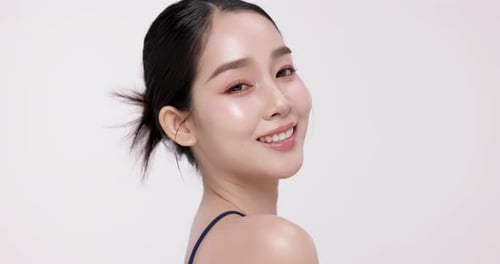 Slow motion of beautiful young Asian girl with k-beauty make up style.