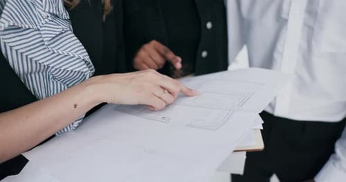 A Closeup Shot Reveals the African Couple and Real Estate Agent in Deep Discussion Strategizing and