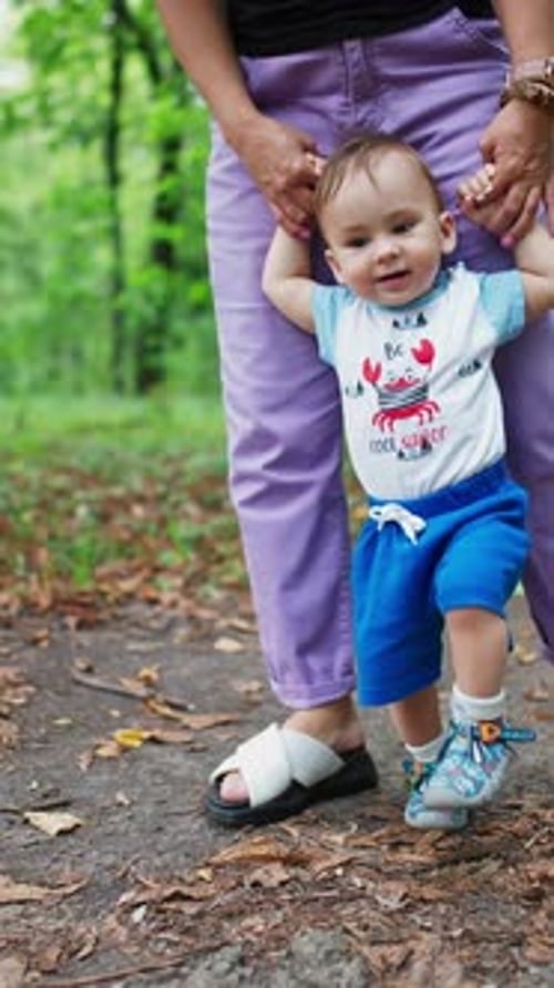 Teaching baby boy to walk.