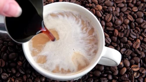 Pouring Black Coffee Into White Ceramic Cup Top View Close Up Hot Coffee Drink Pour Into Cup From