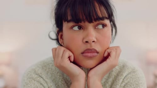 Woman with sad face in home, thinking of mental health and depression thoughts in poor depressed