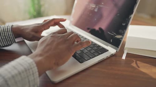 Closeup View of Black Man Hands on Keyboard of Laptop Freelancer Working Online African American