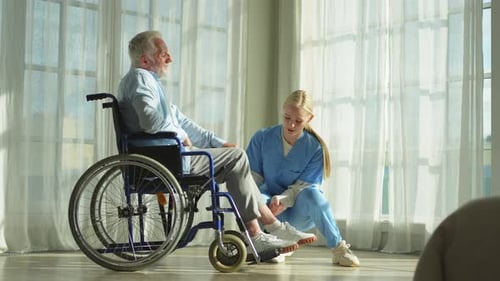 Help Support Retirement Healthcare Nurse Helping Old Man in Wheelchair Patient and Woman in Nursing