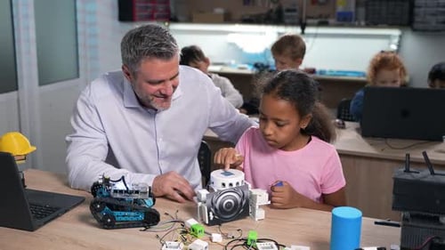 African Elementary Student Building Robotics