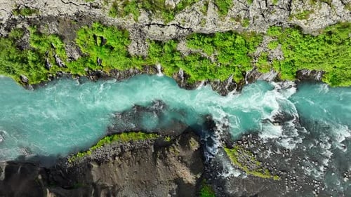 Blue Glacial River with Many Small Waterfalls Stunning Bird's Eye View Cold Turquoise Glacial River