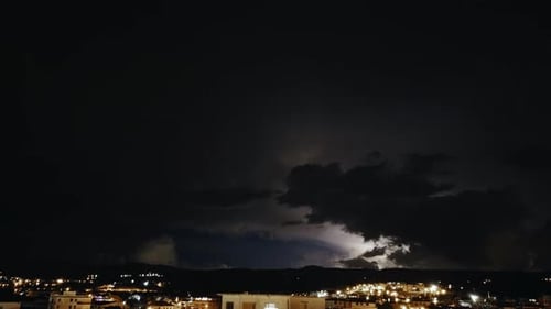Time Lapse Lightning in the Sky Above the City at Night