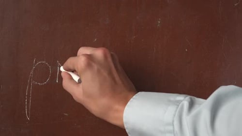 Textured Brown Chalkboard Background Male Hand Writing 'Profit' and a Bitcoin Symbol on the Board