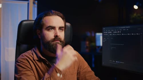Bearded Man Thinking About Code at Night