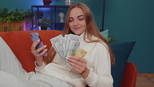 Young Woman Mobile Banking with Cash and Card