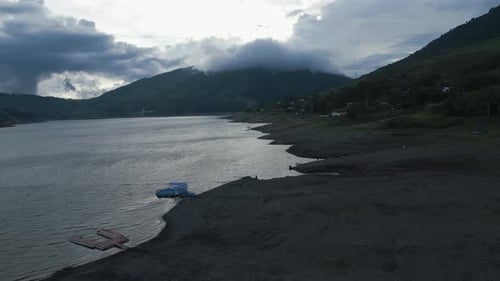 Aerial Lake Calima at Sunset Close to Ground. Dolly Forward Shot. Valle del Cauca. Colombia