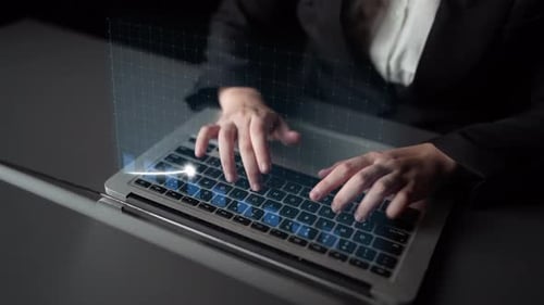 Woman Typing on Laptop with Business Graph Overlay