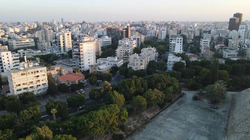 Aerial view of the evening city from above. High-rise building and urban development.