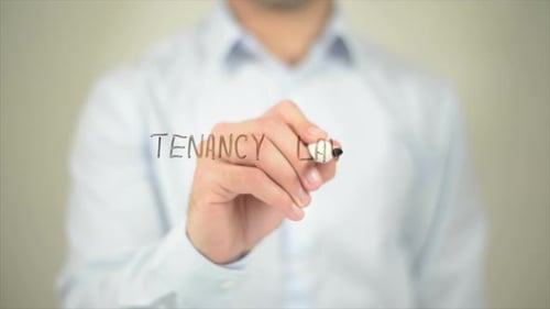 Tenancy Law, Man Writing on Transparent Screen