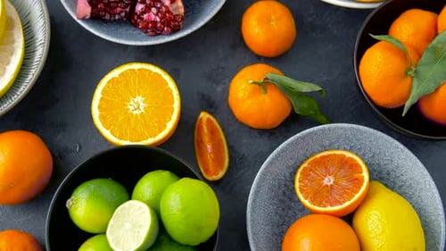 Food, Healthy Eating and Vegetarian Concept - Close Up of Citrus Fruits