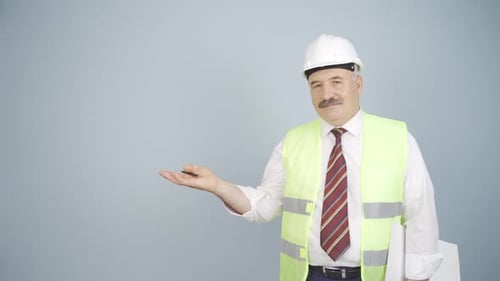 Man in Hard Hat Presents with Open Hand