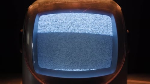 Vintage Television Showing Static Noise in the Dark