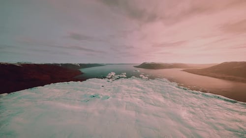 Breathtaking Aerial Shot of Icy Fjord at Sunset with Silhouettes
