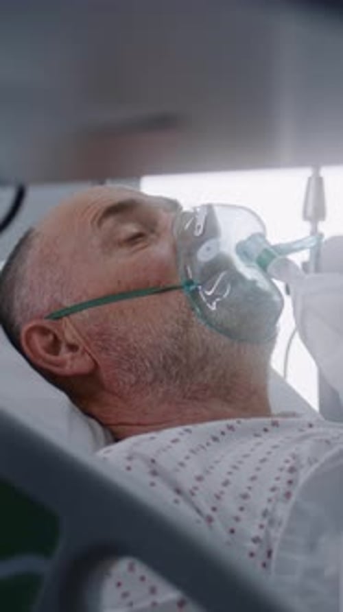 Nurse Takes Care of Patient in Intensive Care Department