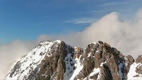 Snowy Mountain Peaks Under Blue Sky. British Columbia, Canada.