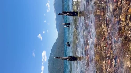 Vertical shot of Argentinian Patagonia landscape with clear water and mountains
