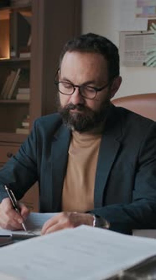 Vertical Portrait of Male School Psychologist at Work