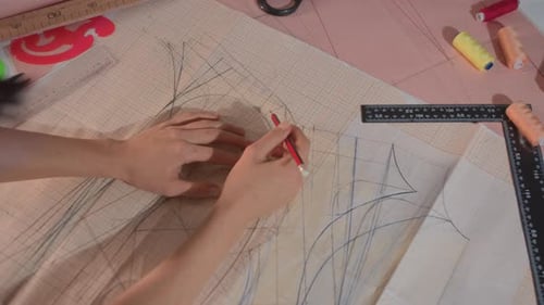 Woman Drawing Pattern in Studio