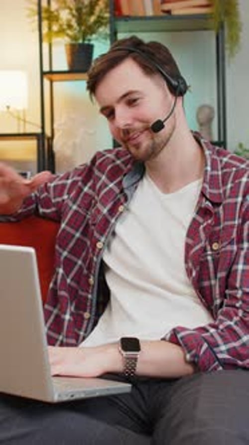 Man on Laptop Video Call at Home