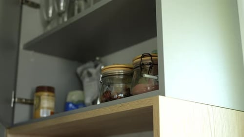 Woman Open Cupboard Door in Kitchen Furniture